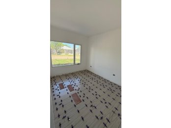 HERMOSA CASA A ESTRENAR EN ORO VERDE, 2 DORM Y FONDO VERDE.