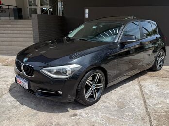 BMW  118I SPORT  5 P. AUT. Recibo vehículo de menor y mayor valor.
