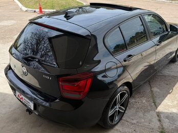 BMW  118I SPORT  5 P. AUT. Recibo vehículo de menor y mayor valor.